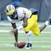 Michigan -junior quarterback Denard Robinson fumbles the ball  during the first half at Iowa on Saturday. Melanie Maxwell I AnnArbor.com